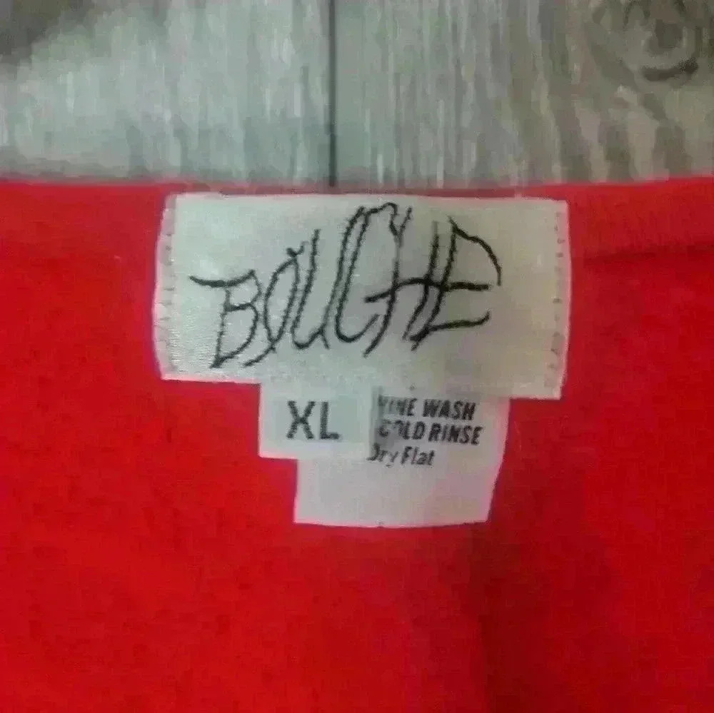 Vintage Bouche red sweater with jean pockets and rhinestone embellishments.